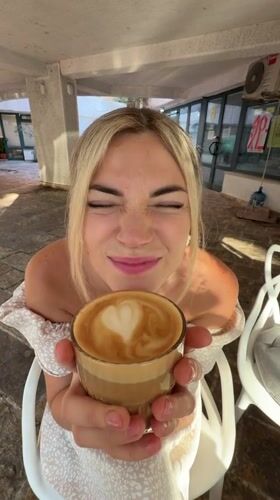 Morning coffee and a street cat in Budva, Montenegro