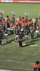 College marching band performs at nighttime stadium event in Davie