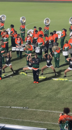 College marching band performs at nighttime stadium event in Davie