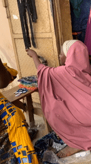 Women conduct textile business at Nigerian market