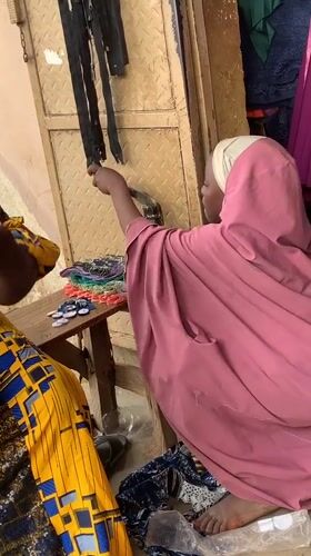 Women conduct textile business at Nigerian market