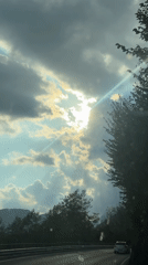 Sunbeams break through stormy clouds over northern Italy