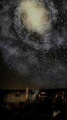 Live concert under a galaxy-projected domed ceiling