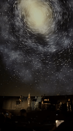 Live concert under a galaxy-projected domed ceiling