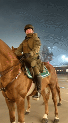 Traditional drummers perform in Santiago as mounted police patrol