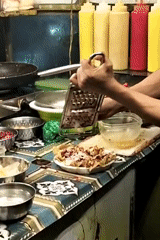 Street food vendors prepare dishes in Dhaka Bangladesh