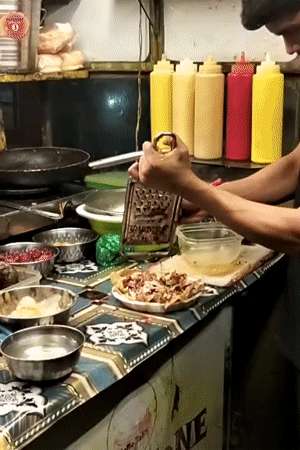 Street food vendors prepare dishes in Dhaka Bangladesh