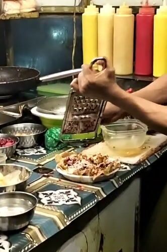 Street food vendors prepare dishes in Dhaka Bangladesh