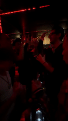 Late night party scene captured at Bonnie's rooftop club