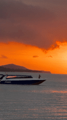 Speedboat Siriwan cruises Baan Bang Rak waters at sunset