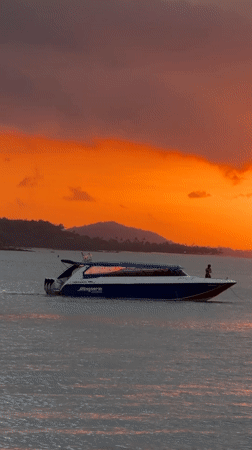 Speedboat Siriwan cruises Baan Bang Rak waters at sunset