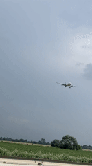 Plane on final approach, Kia on the road below