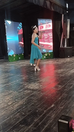 Early morning performances captured on outdoor stage in Porlamar