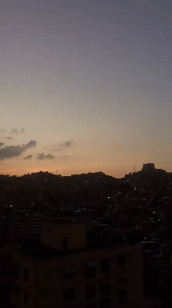 Evening urban life captured across Caracas neighborhoods