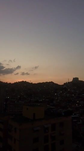Evening urban life captured across Caracas neighborhoods