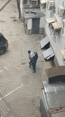 Two people observed in Moscow courtyard, morning hours