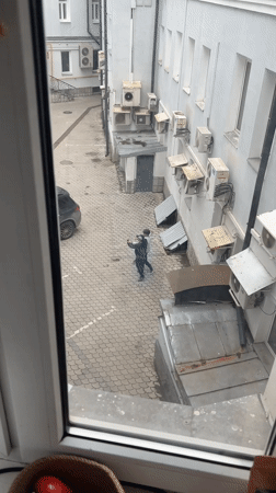 Two people observed in Moscow courtyard, morning hours