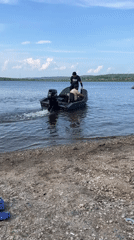 Lazy summer morning at a Russian lake with boats and swimming