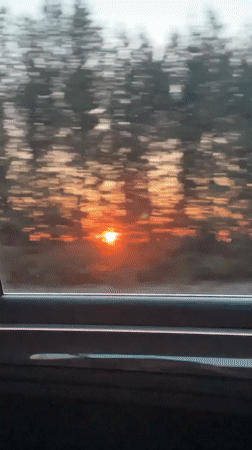 Sunset captured from moving vehicle in Buranovo, Russia