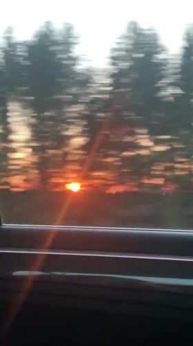 Sunset captured from moving vehicle in Buranovo, Russia