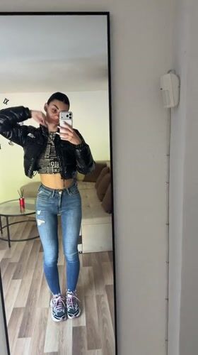 Woman Takes Mirror Selfies in Gabrovo Indoor Location