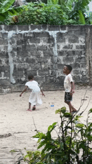 Kids playing outside on a sandy morning in Badagry, Nigeria.