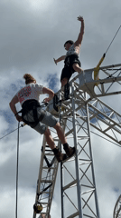 Aerial performers demonstrate high ropes routine in Cudworth square