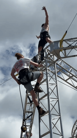 Aerial performers demonstrate high ropes routine in Cudworth square