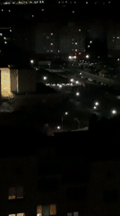 Nighttime aerial view of illuminated Hrodna cityscape