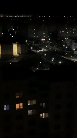 Nighttime aerial view of illuminated Hrodna cityscape