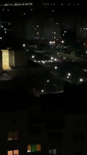 Nighttime aerial view of illuminated Hrodna cityscape