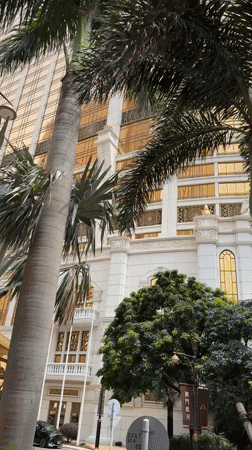Morning documentation of Macao's luxury architecture during rainy weather