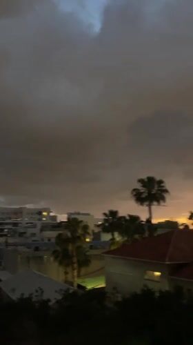Sunset documented over Raanana cityscape amid overcast skies