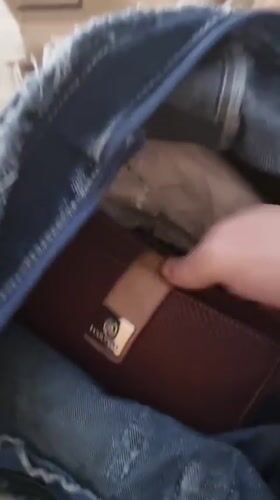 Person searches bag, handles keys in Spanish town challenge