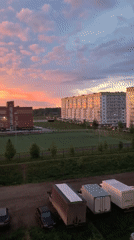 Vibrant sunset displays colorful sky over Фролы, Russia neighborhood
