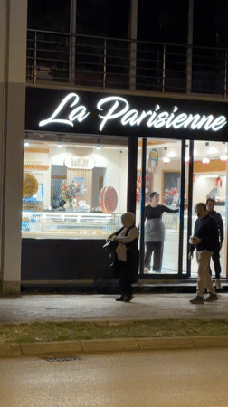 Evening pedestrian activity captured along Bar, Montenegro commercial street