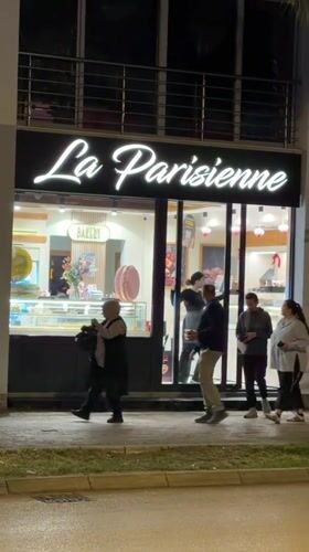 Evening pedestrian activity captured along Bar, Montenegro commercial street