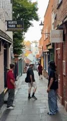 Casual street activity documented in Nottingham's Hurts Yard alleyway