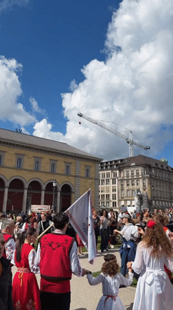 Folk dancers gather in Munich town square Sunday morning