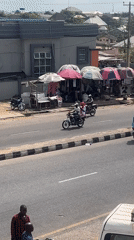 Motorcycle taxis operate on residential street in Lokoja