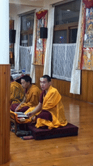 Buddhist monks gather in temple hall in northern India