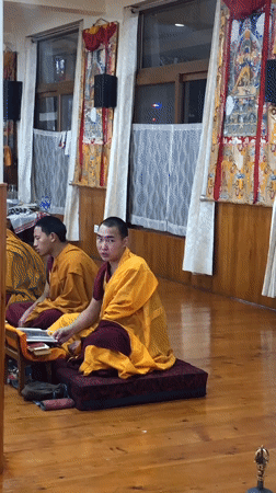 Buddhist monks gather in temple hall in northern India