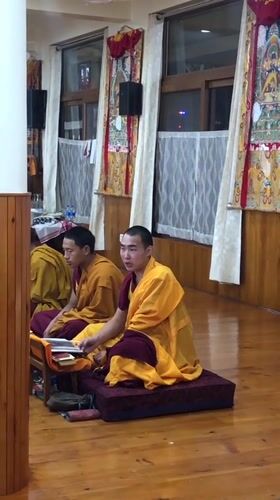 Buddhist monks gather in temple hall in northern India