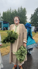 Folk festival with costumes, traditional dancing, games, and food stalls