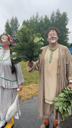Folk festival with costumes, games, and traditional dancing on a rainy day
