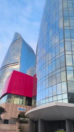 Walking tour documents Baku landmarks and architecture during afternoon