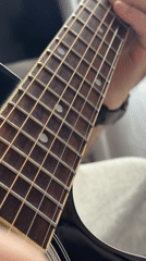 Acoustic guitar performance captured in Moscow street scene