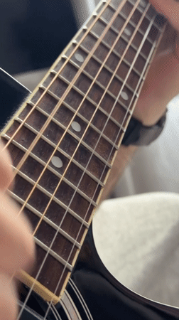 Acoustic guitar performance captured in Moscow street scene