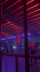 Couples dance under flashing lights in Accra nightclub