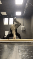 Young man practices breakdancing moves in Krasnoyarsk dance studio